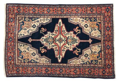 Lot 1446 - Senneh Rug Persian Kurdistan The deep indigo field centred by an unusual ivory medallion framed...