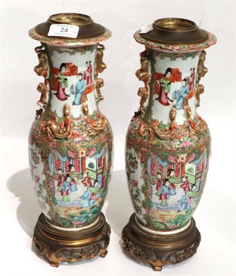 Lot 24 - A pair of 19th century Canton Famille rose vases, converted to table lamps with gilt metal mounts