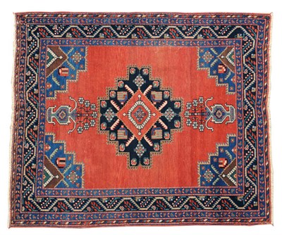 Lot 1449 - Afshar Rug South East Persia The plain madder field with central stepped indigo medallion and...