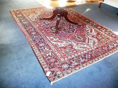 Lot 1450 - Heriz Carpet of Small Size Persian Azerbaijan The madder field centred by an indigo medallion...