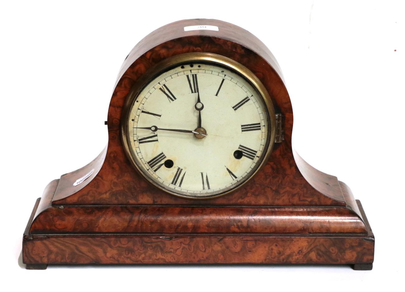 Lot 39 - A late Victorian walnut veneered striking mantel clock