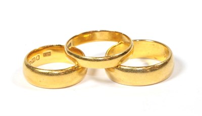 Lot 55 - Three 22 carat gold band rings, finger sizes K1/2, Q and R1/2