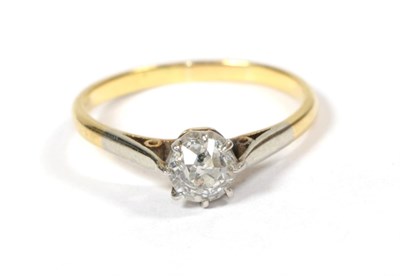 Lot 56 - A diamond solitaire ring, the old cut diamond in a white claw setting, to a yellow tapered shoulder