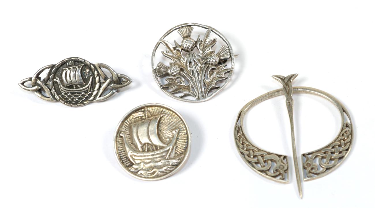 Lot 65 - Four Scottish silver brooches, of varying designs, all stamped 'IONA'