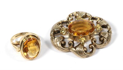 Lot 68 - A yellow metal and gemset brooch, unmarked, measures 4.3cm by 3.9cm; and a gemset ring, stamped...