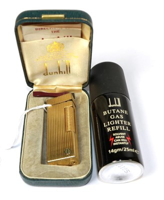 Lot 74 - A Dunhill ''Rollagas'' lighter, box and accessories