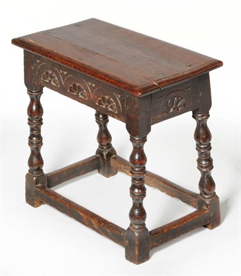 Lot 1454 - An Oak Joint Stool, with a lunette carved frieze above ring turned baluster legs united by a...