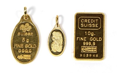 Lot 81 - Two pendants stamped 'Fine Gold' and a gold bar (3)