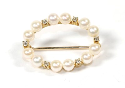 Lot 83 - A cultured pearl hoop brooch, with applied plaque stamped '750', length 2.5cm