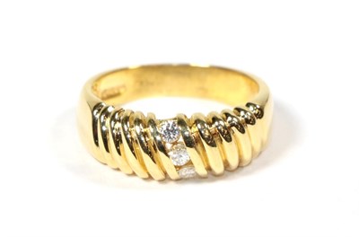 Lot 85 - An 18 carat gold diamond three stone ring, total estimate diamond weight 0.15 carat...
