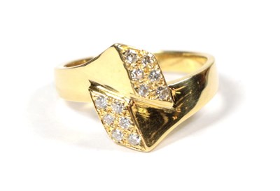 Lot 87 - An 18 carat gold diamond cross over ring, finger size L1/2