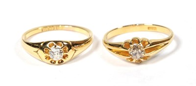Lot 88 - An 18 carat gold diamond solitaire ring, finger size M1/2; and a diamond solitaire ring,...