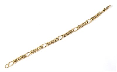 Lot 93 - A 9 carat gold rollerball figaro link bracelet, length 18.5cm