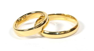 Lot 111 - Two 18 carat gold band rings, finger sizes L and W (2)