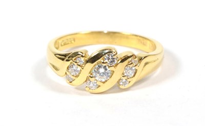 Lot 112 - An 18 carat gold diamond twist ring, finger size P
