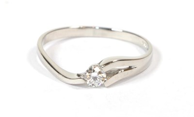 Lot 113 - A platinum diamond solitaire ring, a round brilliant cut diamond in a split shoulder tension...