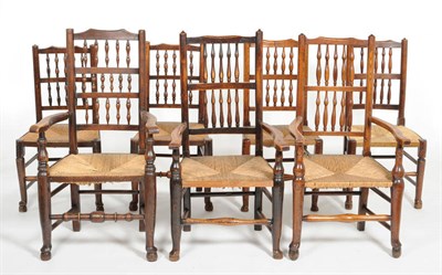 Lot 1458 - Two Early 19th Century Lancashire Ash and Rush Seated Chairs, the comb shaped top rail above a...