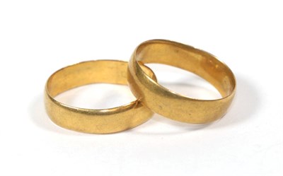 Lot 120 - Two 22 carat gold band rings, L1/2 and M (2)