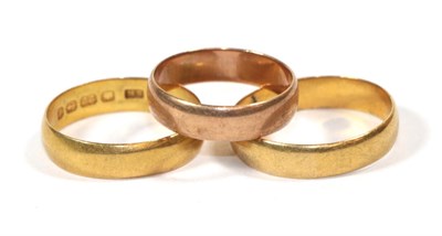Lot 123 - Two 22 carat gold band rings, finger sizes N1/2 and P1/2; and a 9 carat gold band ring, finger size