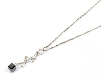Lot 125 - A white and black diamond pendant, marks indistinct, on a platinum chain, pendant length 3cm, chain