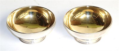 Lot 141 - A pair of Elizabeth II silver bowls, by Whitehill Silver and Plate Co., London, 2000, circular...