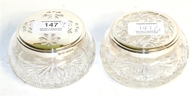 Lot 147 - Two Elizabeth II silver-mounted cut-glass dressing-table jars, the silver mounts by Barker Brothers