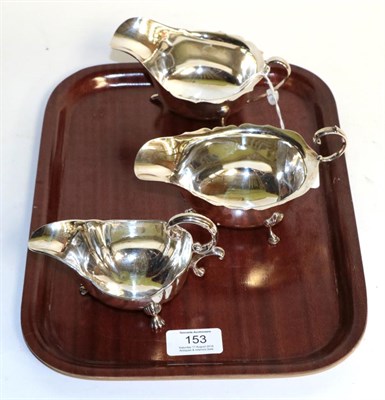 Lot 153 - Three silver sauceboats, one by Adie Brothers, Birmingham, 1938, one by Vines, Sheffield, 1946...
