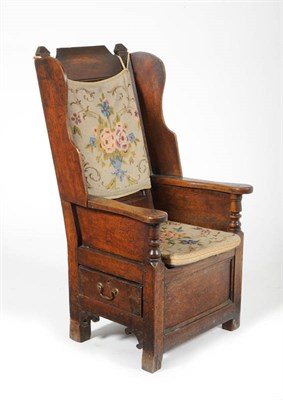 Lot 1462 - An Early 18th Century Joined Oak Armchair, the back support above flared sides, the armrests...