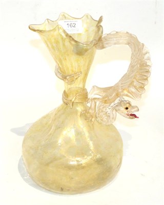 Lot 162 - A Venetian glass jug, applied dragon handle and mottled gilt decoration