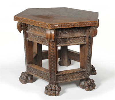 Lot 1463 - A Victorian Oak Centre Table, 3rd quarter 19th century, the cleated hexagonal top above a leaf...