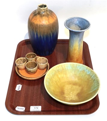 Lot 174 - Ruskin pottery including trumpet shaped vase, blue ground vase, bowl, egg cups and small dish, with