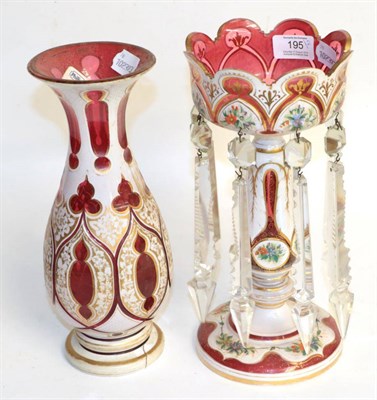 Lot 195 - A 19th century cranberry and white glass lustre and a similar vase