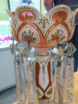 Lot 195 - A 19th century cranberry and white glass lustre and a similar vase