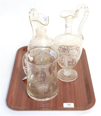 Lot 196 - Two etched glass ewers and an engraved jug