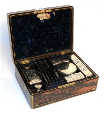 Lot 197 - A William IV silver-mounted dressing table-set, the silver mounts London, 1831, contained in a...