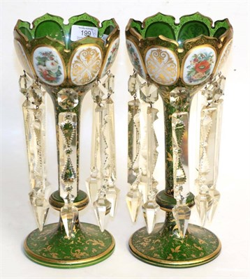 Lot 199 - A pair of floral and gilt decorated 19th century green glass table lustres