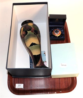 Lot 201 - A Moorcroft vase, with box and booklet; a limited edition Halcyon Days enamel box of the Royal...