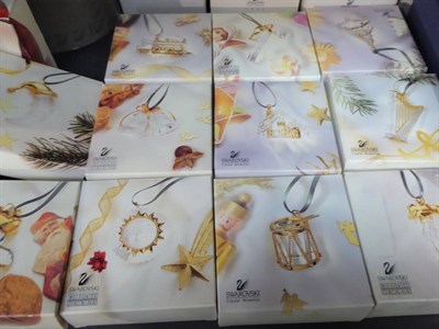 Lot 223 - A selection of Swarovski Christmas tree ornaments (boxed); a Swarovski Christmas star; and...
