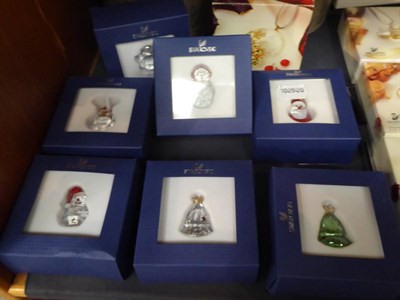 Lot 223 - A selection of Swarovski Christmas tree ornaments (boxed); a Swarovski Christmas star; and...