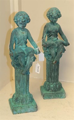 Lot 225 - A pair of fairies on columns