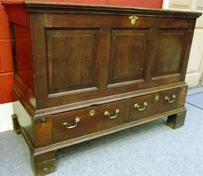 Lot 1469 - An 18th Century Joined Oak Chest, the boarded lid with iron hinges above a dentil frieze, with...