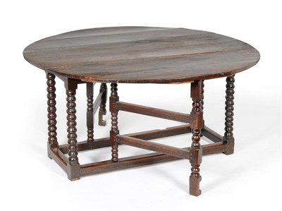 Lot 1470 - A Charles II Joined Oak Six Seater Gateleg Table, late 17th century, the rectangular top with...