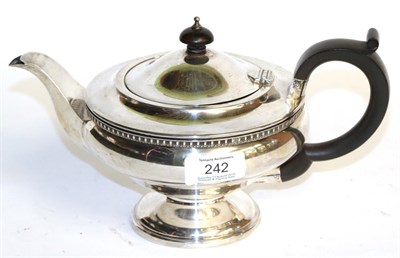 Lot 242 - A George V silver teapot, by James Deakin and Sons, Birmingham, 1931, circular and on spreading...