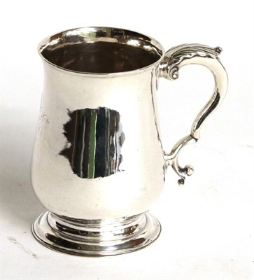 Lot 251 - A George II silver mug, maker's mark rubbed, London, 1759, baluster and on spreading foot, with...