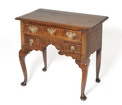 Lot 1472 - A George II Oak Side Table, mid 18th century, the moulded top above a deep frieze drawer and...