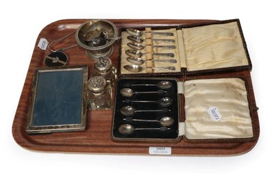 Lot 260 - A set of six cased teaspoons, a set of six cased coffee beans spoons, a silver enamelled compact, a