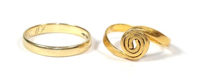 Lot 269 - A band ring, remodelled to a swirl design, unmarked, finger size F; and a band ring stamped...