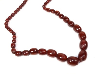 Lot 272 - A red amber type necklace, length 74cm