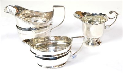 Lot 284 - A George III silver sauceboat, London, 1813, and two other sauceboats, one Birmingham, 1899,...