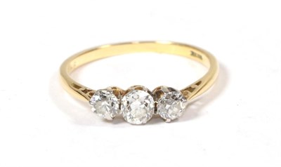 Lot 291 - A diamond three stone ring, stamped '18CT', finger size L1/2